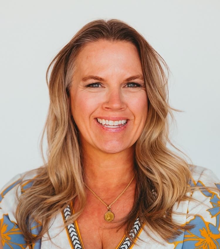 Healing woman smiling, showcasing wellness and vitality, with natural blonde hair and a friendly exp.